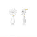 Close-up product image of floral gold earrings with pearl drop accent