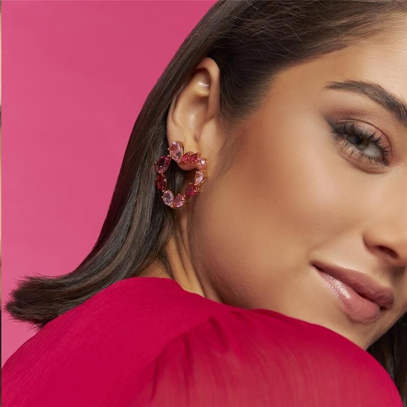 Model wearing Blush Orbit Hoops in rose gold and pink tones