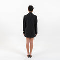Back view of Pinstripe Power Set showing sleek silhouette of the blazer and skirt