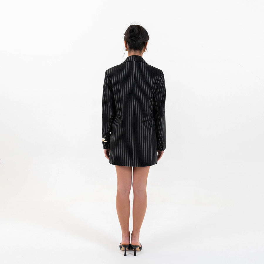 Back view of Pinstripe Power Set showing sleek silhouette of the blazer and skirt