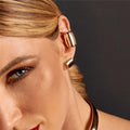 Woman wearing white gold duo earrings with zirconia stones