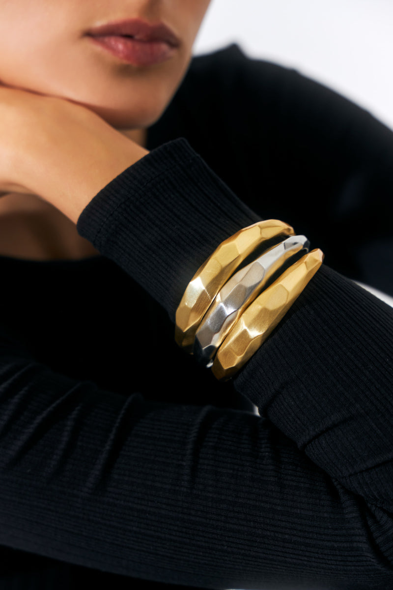 Model wearing gold version of Lunar Satin Bracelet