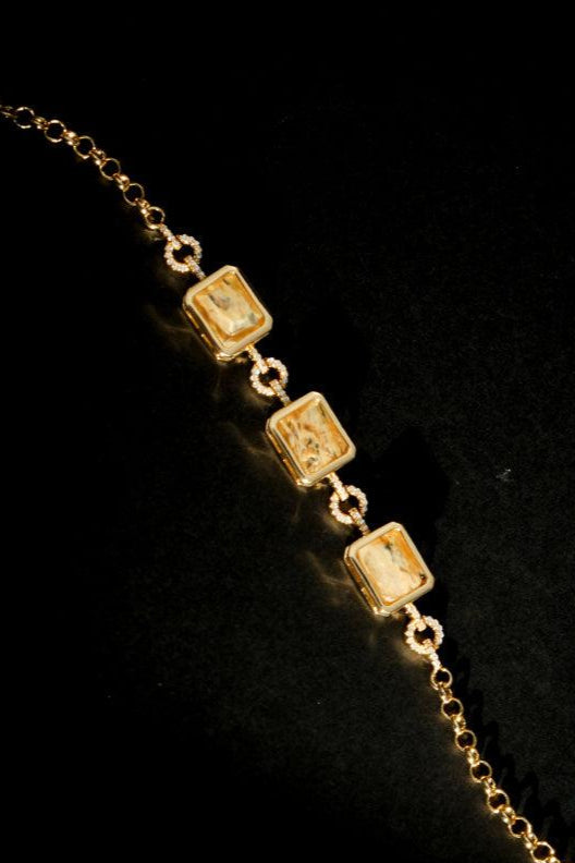 Lyra Bar Bracelet flat lay gold-plated chain with rectangular crystals