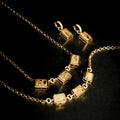Lyra Bar Bracelet styled with layered gold jewelry crystal pendant detail