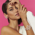 Model wearing spiral ear cuff with four-tone pearls