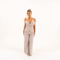 Model in beige set – back view showcasing fit and silhouette