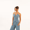 Over-shoulder view of blue set showcasing details and tailoring
