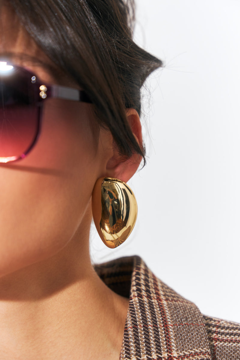 Model wearing Satin Oval Studs with sunglasses