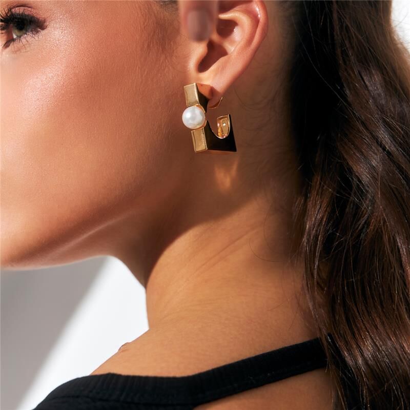 Close-up of model’s ear wearing Square Pearl Hoops with sleek hairstyle