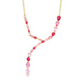 Starlit Lariat Necklace with red and pink crystals in rose gold flat lay